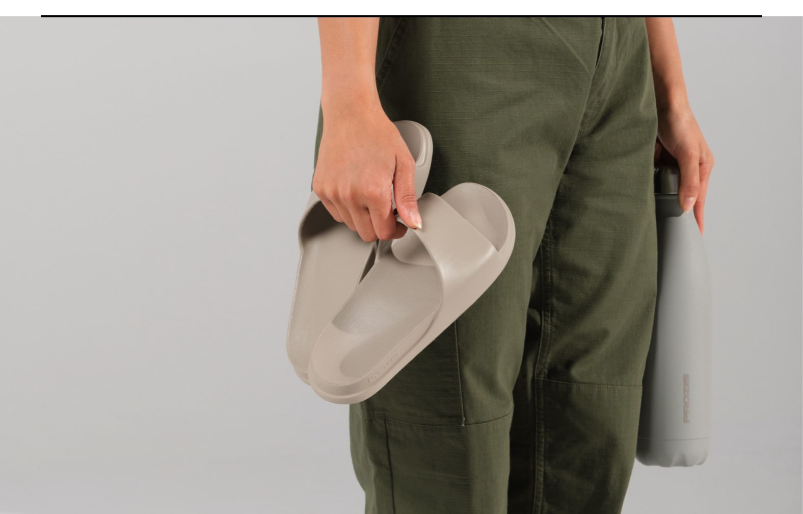 Step into comfort with the Staple Slides in Light Taupe - a thoughtful gift for those who appreciate casual elegance.